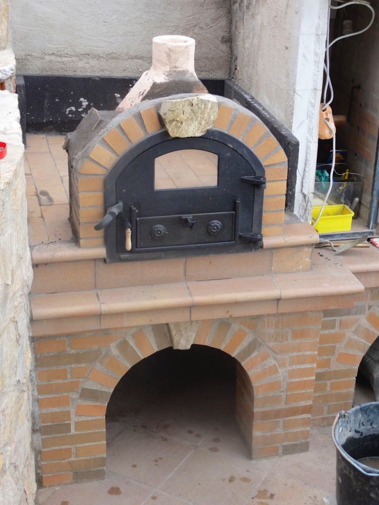 Mein Ofen in Spanien, gleiche Türe. Hier sieht man den Originalgriff